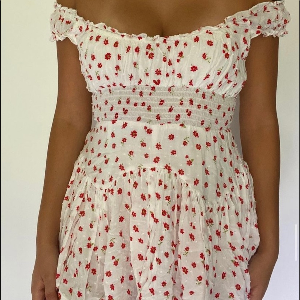 White romper dress with red flowers.